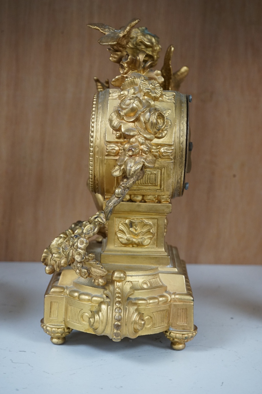 A late 19th century gilt metal cherub timepiece, Ansonia clock company movement, 21cm high